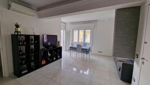 a living room with a television and a table at LG colosseum Rome apartment in Rome