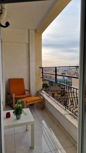 a balcony with a chair and a view of the ocean at LG colosseum Rome apartment in Rome