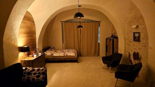 En eller flere senger på et rom på Apartmán na Náměstí.