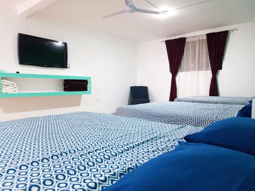 Hotel Posada Los Faroles Atlixcoにあるベッド