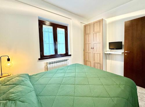 Säng eller sängar i ett rum på Villetta Relax Cansano