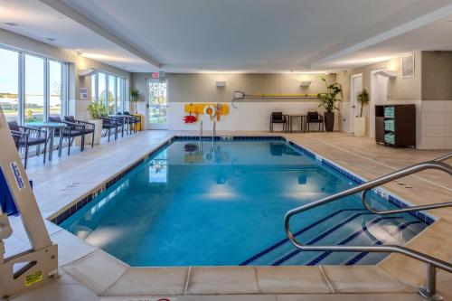 a large swimming pool in a hotel room at TownePlace Suites by Marriott Chesterfield in Chesterfield