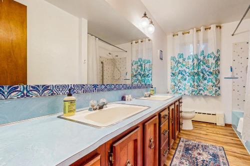 a bathroom with two sinks and a toilet at Pacific Prairie in Woodinville