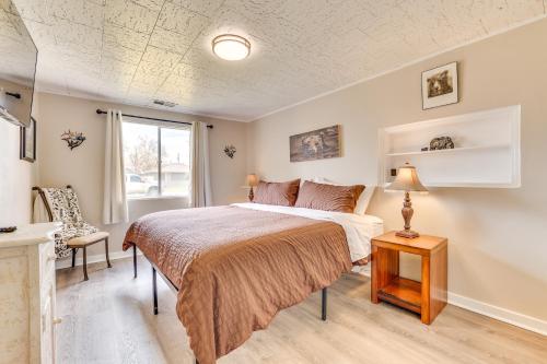a bedroom with a bed and a window at Family-Friendly Ontario Home with Fireplace! in Ontario