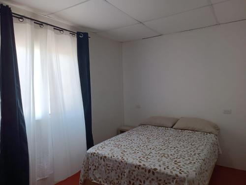 Posteľ alebo postele v izbe v ubytovaní Hotel Posada Los Faroles Atlixco