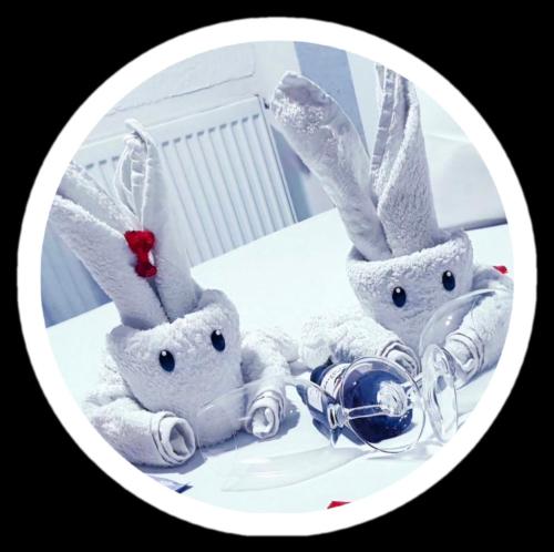 a group of stuffed rabbits sitting on a table at Apartment Sekulic in Doboj