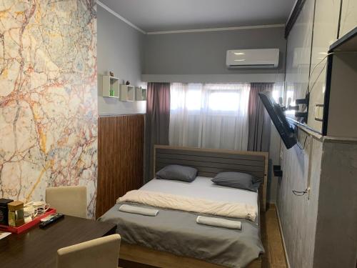 Postel nebo postele na pokoji v ubytování Apartman Dacaa
