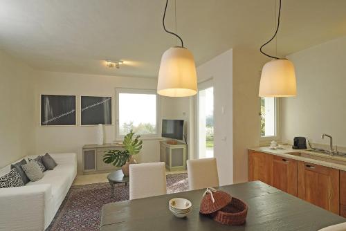 a living room with a couch and a table at Villa Dolce Bellezza in Salò