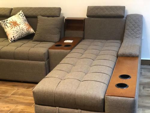 a living room with a couch and a coffee table at Al-Andalos Studio in New cairo