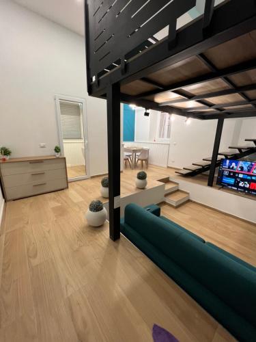 a living room with a couch and a table at Da Lello: Luxury Loft strategico in Marigliano