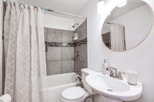 a bathroom with a sink and a toilet and a mirror at Updated Jamestown Home - 5 Mi to HPU! in Jamestown