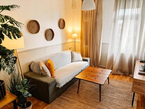 a living room with a couch and a table at Traditional House Old Town Xanthi - MenoHomes 3 in Xanthi