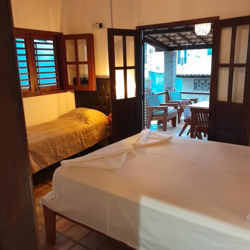 Katil atau katil-katil dalam bilik di Chalé Centro, Praia Pipa