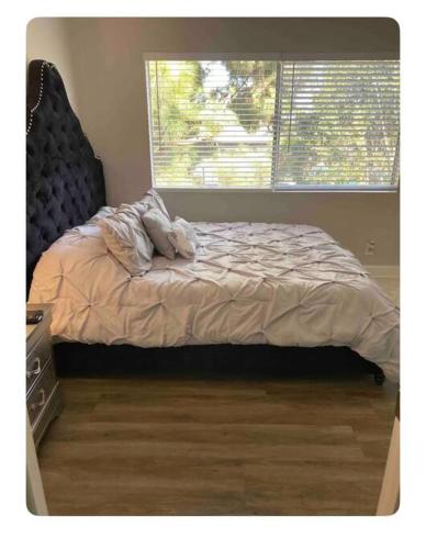 an unmade bed in a bedroom with a window at Gorgeous 1 bedroom Beverly Hills in Los Angeles