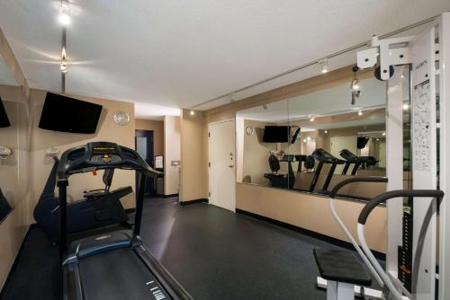a room with a gym with a treadmill and a mirror at Best Western Springfield in Springfield