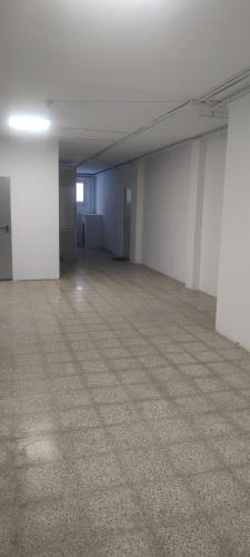 an empty room with white walls and a carpeted floor at ESTUDIO COMPLETO FAMILIAR in La Jonquera