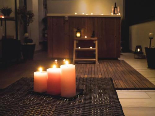 a group of candles sitting on top of a table at GAVAS Jacuzzi Relax Zen in Cluj-Napoca