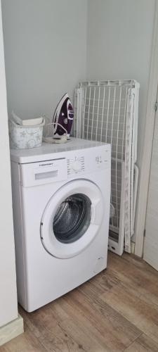 a white washing machine sitting on top of a washer at Casa Visto Mar in Sal Rei