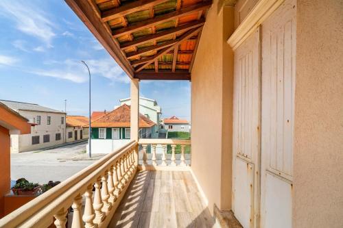 a balcony of a house with a view of a street at Cosy house for Surf & Beach in Esmoriz