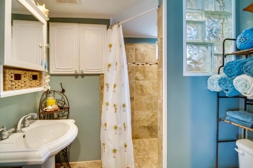 a bathroom with a shower and a sink at Cozy Fort Pierce Cottage on Farm Animal Rescue! in Fort Pierce