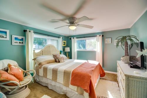a bedroom with a bed and a ceiling fan at Cozy Fort Pierce Cottage on Farm Animal Rescue! in Fort Pierce