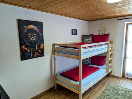 a bunk bed room with two bunk beds in a room at Ferienwohnung Alpenblick Dorner in Oberreute