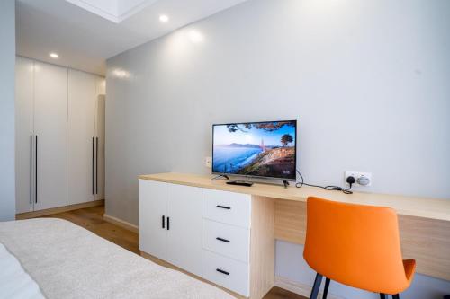 Laurel Hill Suitesにあるテレビまたはエンターテインメントセンター