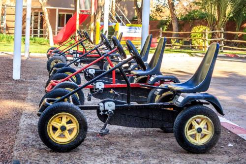 a row of empty carts sitting on a playground at Barceló Palmeraie Oasis Resort in Marrakech