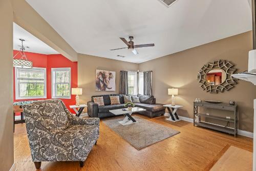 a living room with a couch and a table at Lovely Big House with an office in Atlanta, Close to the Airport in Atlanta
