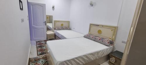 Postel nebo postele na pokoji v ubytování Sandbeach apartment