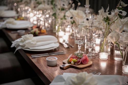 a table with a table set up for a wedding with flowers at Delta Hotels by Marriott Dallas Southlake in Southlake