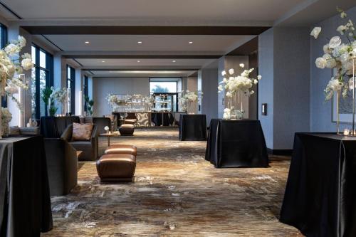 a banquet hall with tables and chairs and a table set up at Delta Hotels by Marriott Dallas Southlake in Southlake