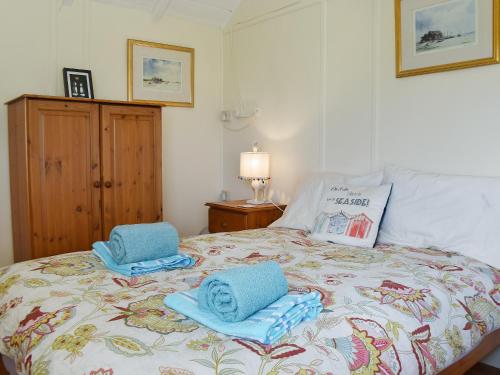 Postelja oz. postelje v sobi nastanitve Bacton Seaview Bungalow