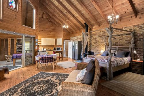 a bedroom with a bed and a living room at Valla Beach Top Spot in Valla