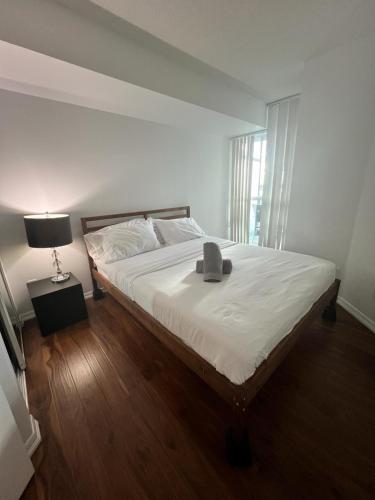 a bedroom with a bed with a box on it at Downtown Toronto Suite By The Lake in Toronto