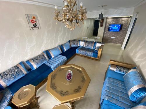 an overhead view of a living room with a blue couch at Appartement Ceramica N17 FNIDEQ in Fnidek