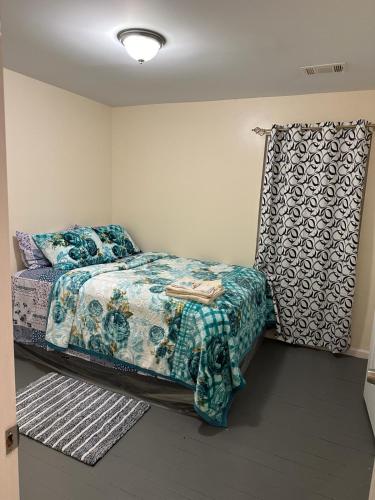 a bedroom with a bed and a curtain at Divine Villa and Resorts 67 Sherman 5mins to EWR Airport and 4mins to Penn Station Newark, 20Mins to New York in Newark