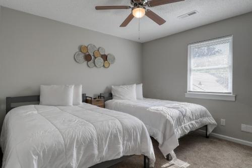 a bedroom with two beds and a ceiling fan at 1408 Perrin Dr, Unit B - Ocean Walk Sleeps 8 in Myrtle Beach