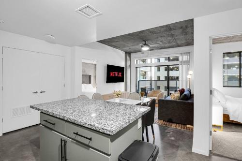 a kitchen and living room with a couch and a table at The Nomad Roosevelt in Phoenix
