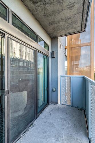 a balcony of a building with a glass door at The Nomad Roosevelt in Phoenix