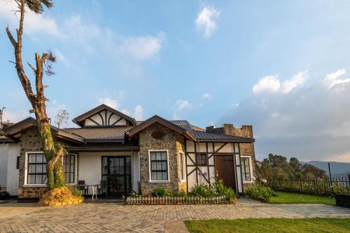 a house with a metal roof at Dover Cottage in Nuwara Eliya