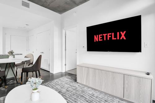 a living room with a television on a wall at The Nomad Roosevelt in Phoenix