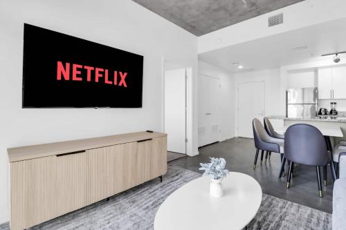 a living room with a netflix sign on a wall at The Nomad Roosevelt in Phoenix