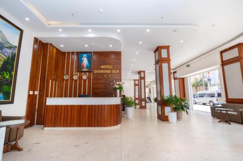 a lobby with a reception desk in a building at Diamond Sea Hotel in Vung Tau