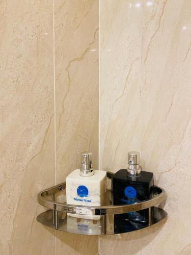a bathroomrior with a mirror and two complimentary complimentary at HOANG TRIEU-MARINA Thu Dau Mot in Ấp Phú Thọ