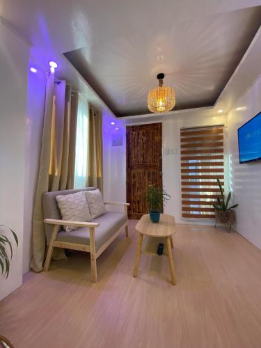 a living room with a couch and a table at Isla Amakan Homestay North Siargao in Alegria