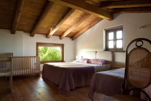 Posteľ alebo postele v izbe v ubytovaní La Casa Griunit
