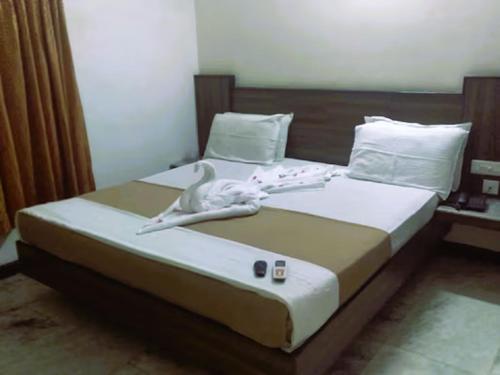 Tempat tidur dalam kamar di Hotel Archana