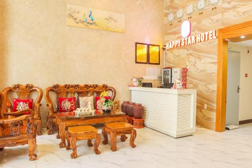 a room with wooden chairs and a table at Happy Star Hotel Nha Trang in Nha Trang