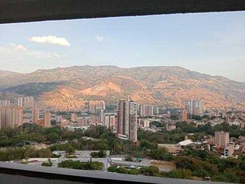 a view of a city with mountains in the background at Apartamento en Edificio Puerto paraiso en Bello Antioquia in Bello